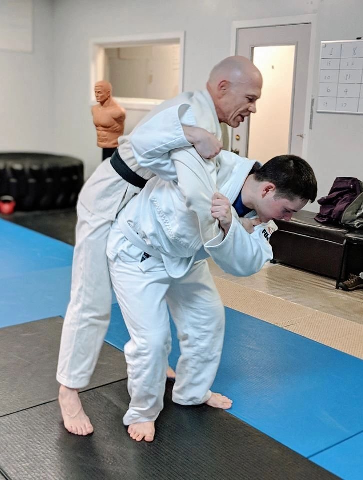 Chris Snyder teaching a judo throw at Snyder Dojo in Kalamazoo